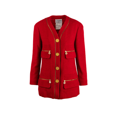 Chanel red wool bouclé tweed jacket. Blazer style with lapel-less collar, marked shoulders, long sleeves and four front pockets. Decorated with a zip fastening and gold CC logo buttons pre-owned nft