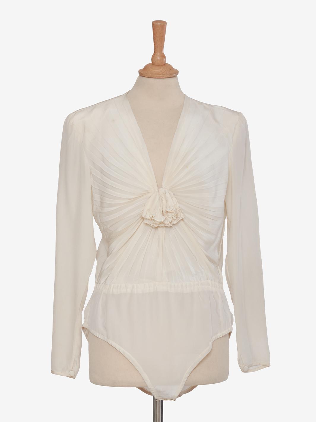 Juanita Sabbadini White silk bodysuit.