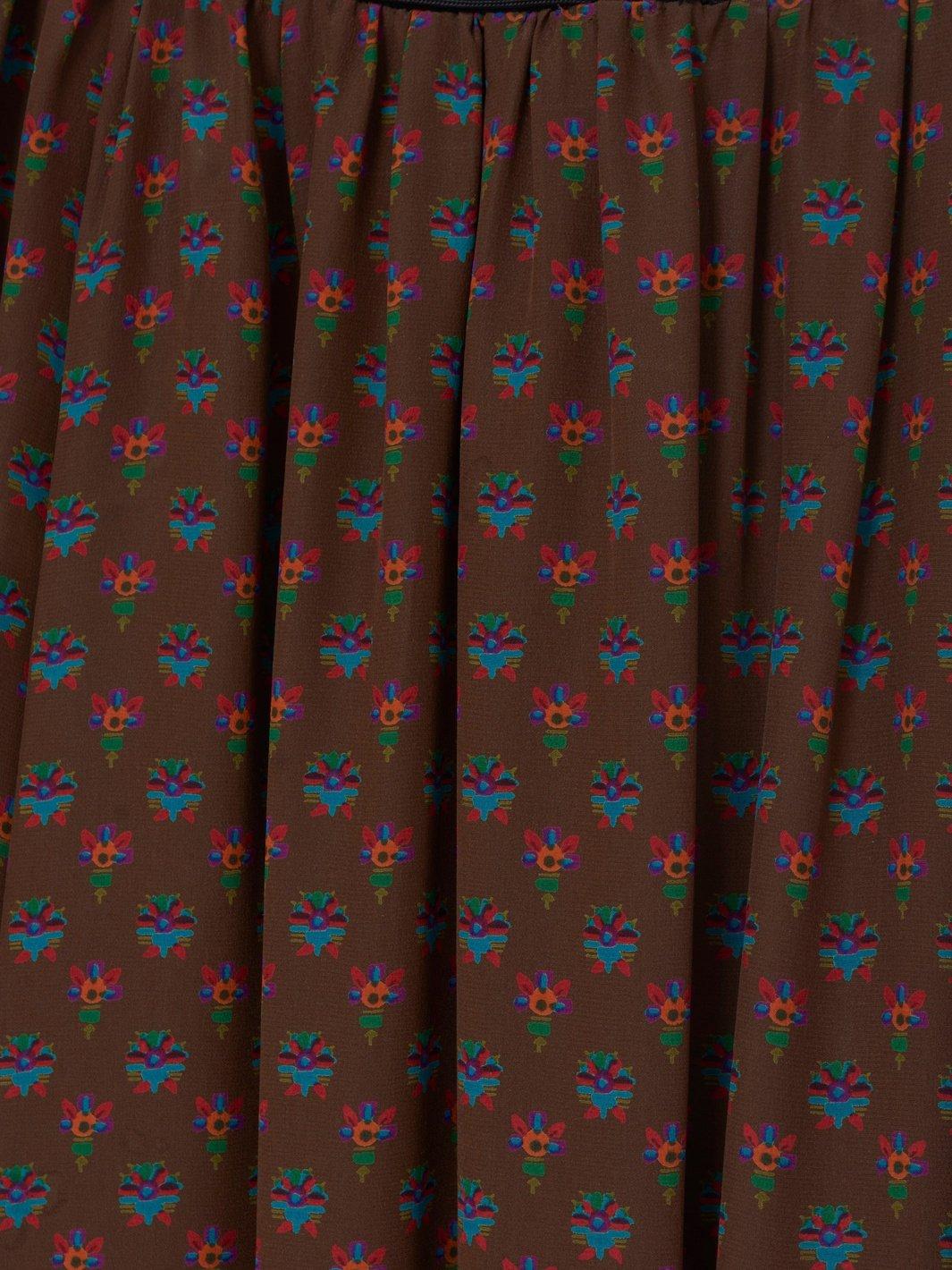 1970s Yves Saint Laurent in brwn silk with puffed sleeves
