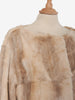 Pelliccia beige di lunghezza midi<br>