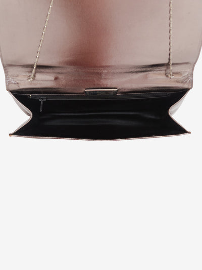 Metallic effect clutch bag with applications
