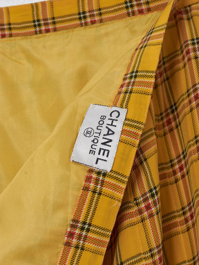Chanel Boutique suit in ochre yellow silk