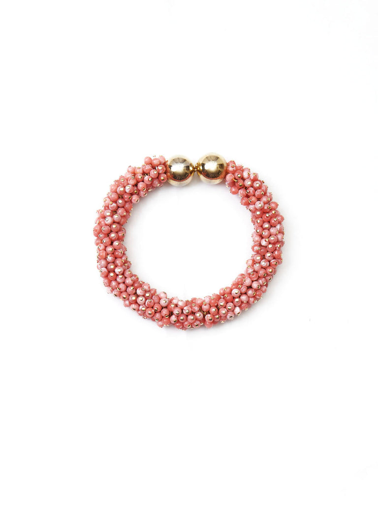 1980s Nina Ricci semi-rigid bracelet in coral-colored beads
