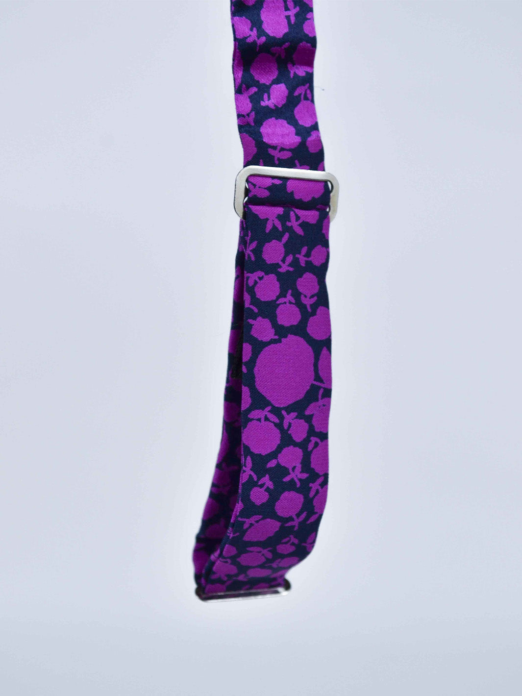 1980s silk bow tie with violet flowery print on black background